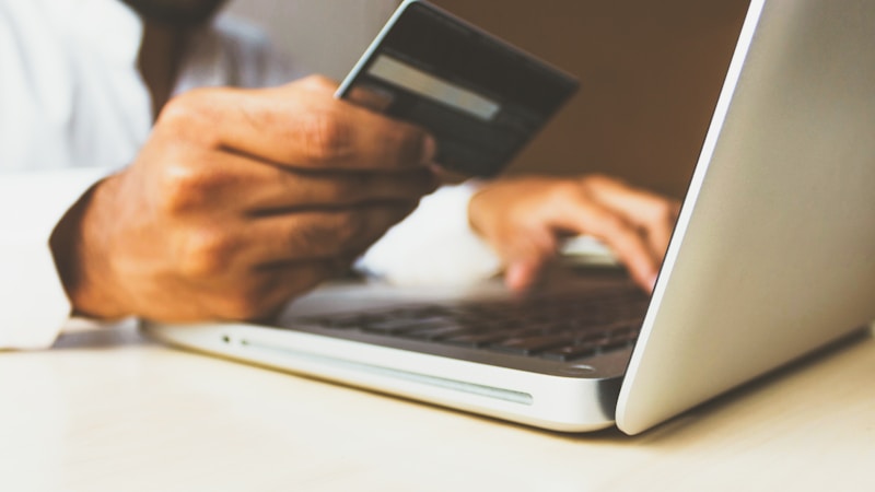 Laptop and security review used for checking ACN fraud and supplier impersonation risks