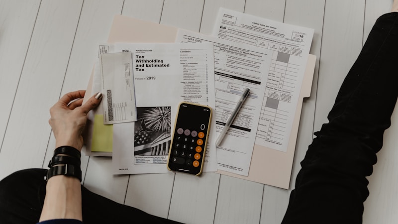 Finance manager checking medical supplier invoices for fraud and bank detail changes